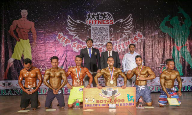 The winners of the VIP Sports & Fitness BABF Men's Volleyball Championship with the President of Bangladesh Bodybuilding Federation Major General (Retd) Subid Ali Bhuiyan and the guest and official of Bangladesh Bodybuilding Federation pose for a photo s