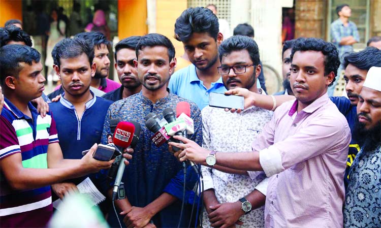 Quota reformists convener Hasan AL Mamun speaking at a press conference in front of Dhaka University Central Library on Monday demanding gazette publication on Quota.