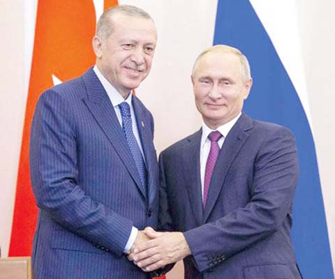 Russian President Vladimir Putin (right) and his Turkish counterpart Recep Tayyip Erdogan shake hands during a news conference following their talks in Sochi, Russia, on Monday. AP file photo