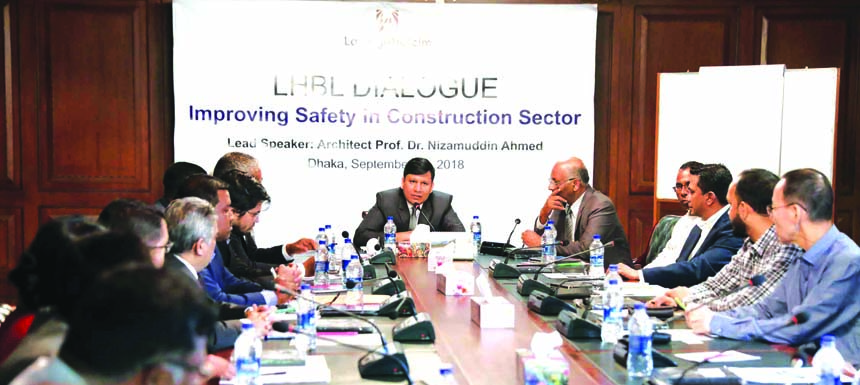 Rajesh K Surana, CEO of Lafarge-Holcim Bangladesh, presiding over a roundtable discussion on 'Improving Safety in Construction Sector' at a city hotel on Saturday. Architect Professor Dr Nizamuddin Ahmed of BUET, Mohiuddin Babar, Communication Consultan