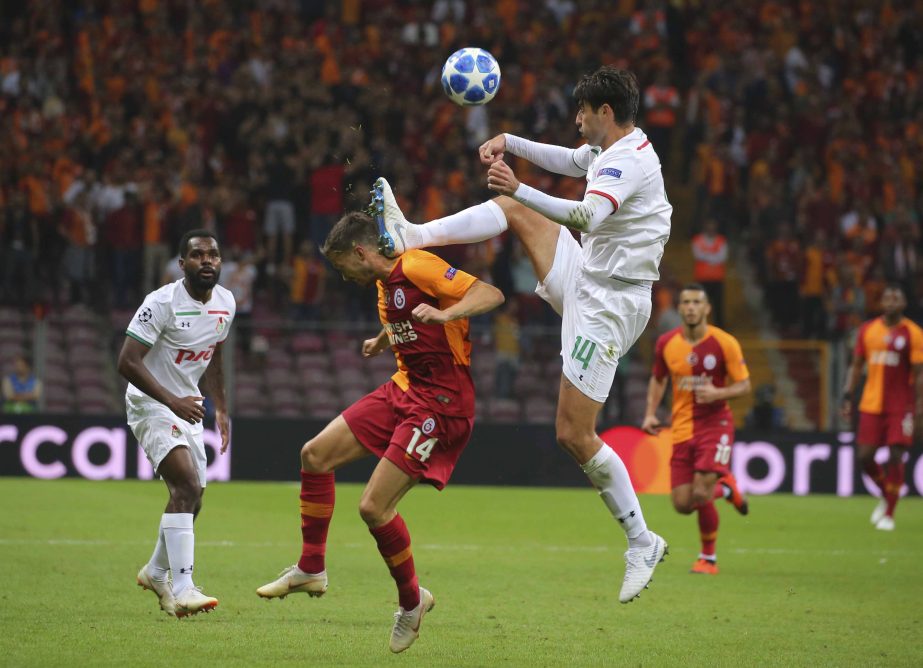 Galatasaray's Martin Linnes (left) tries to stop Lokomotiv Moscow's defender Vedran Corluka (right) during the Champions League Group D soccer match between Galatasaray and Lokomotiv Moscow, in Istanbul on Tuesday.