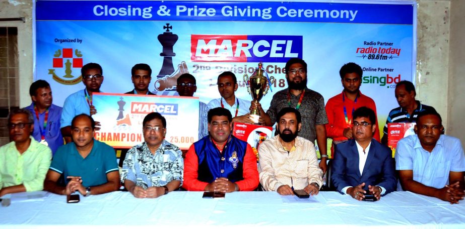 The winners of the Marcel Second Division Chess League with the guests and officials of Bangladesh Chess Federation pose for a photo session at Bangladesh Chess Federation hall-room on Wednesday.