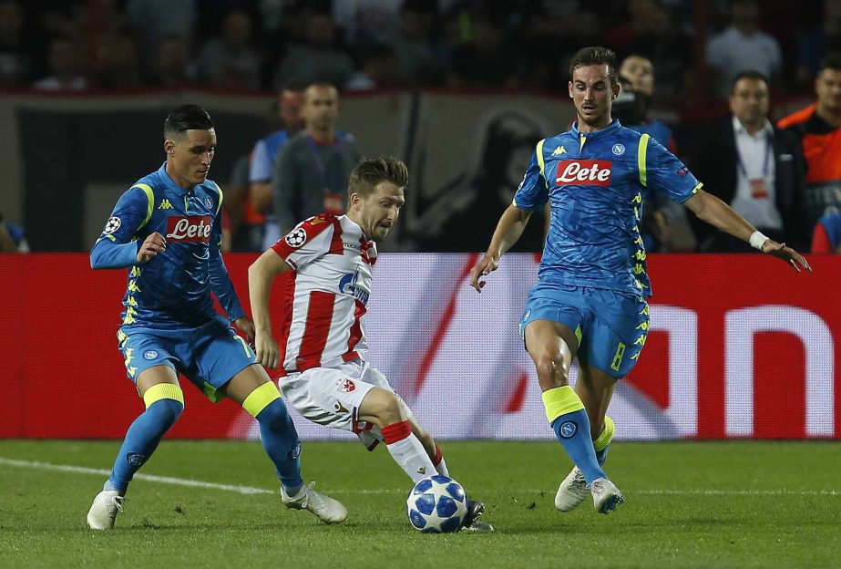 Red Star's Marko Marin (center) is challenged by Napoli forward Jose Callejon (left) and Fabian Ruiz, during the Champions League group C soccer match between Red Star and Napoli, in Belgrade, Serbia on Tuesday.