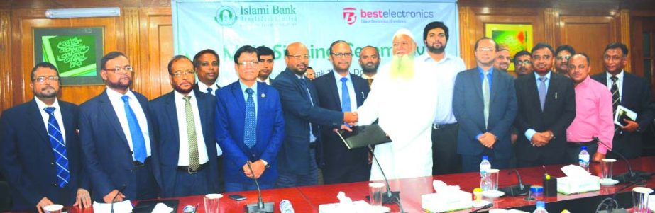 Abu Reza Md. Yeahia, DMD of Islami Bank Bangladesh Limited and Md. Asaduzzaman, Managing Director of Best Electronics, exchanging an agreement signing document at the Bank's head office in the city recently. Under the deal, Khidmah (credit) cardholders o