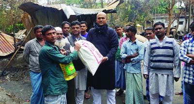 Aspirant MP candidate of Awami League Md Niaz Morshed Elite distributing relief goods among the fire-affected people at Abutorab area at Mirsari recently .