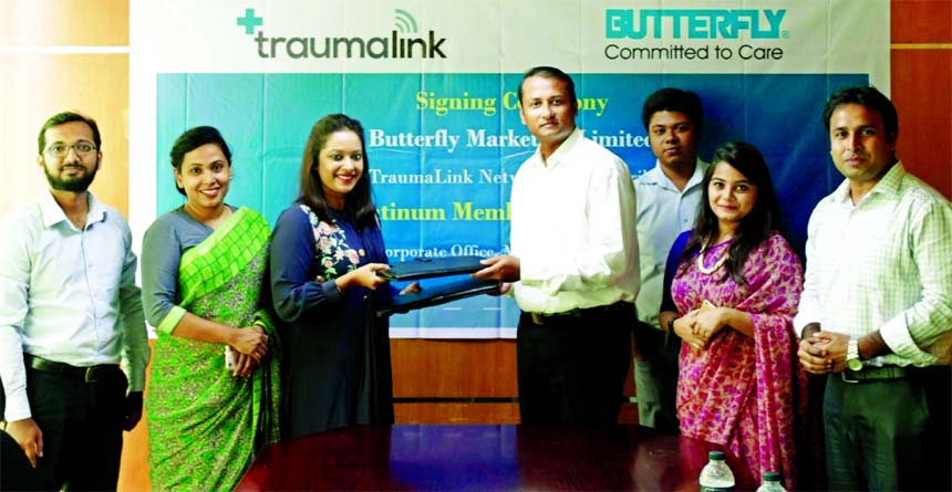 Mahbub-Ur Rahman Shajib, Director (Operations) of Butterfly Marketing Limited (BML) and Esha Chowdhury, Executive Director of TraumaLink, exchanging an agreement signing document at BML head office in the city on Monday. Senior officials from both the com
