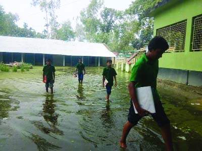 JAMALPUR: Academic activities of Chechiabadha Govt Primary School in Sarishabari Upazila are being hampered due to water-logging and pollution . This picture was taken on Saturday .