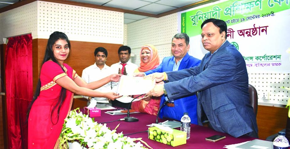 Salim Uddin, Chairman of the Board of Directors of Bangladesh House Building Finance Corporation (BHBFC), distributing certificates among the participants of Foundation Training Course at its head quarters in the city recently. Debasish Chakrabarty, Manag