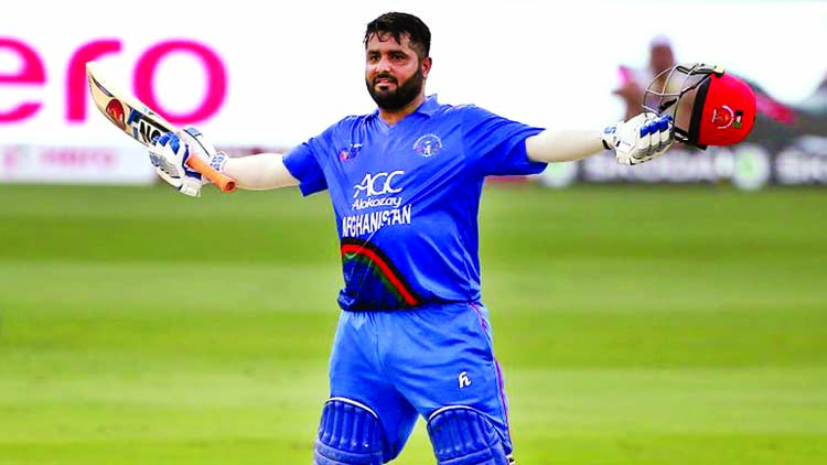 Mohammad Shahzad of Afghanistan celebrating his century against India.