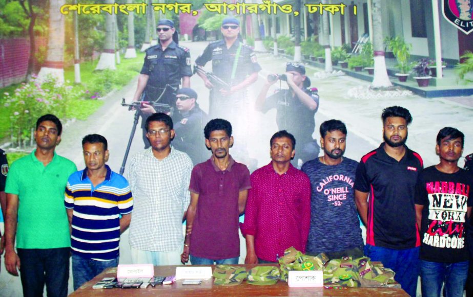 Eight people including two fake army Major were arrested by RAB-2 from in front of the Passport Office in city's Sher-e-Bangla Nagar on Tuesday.