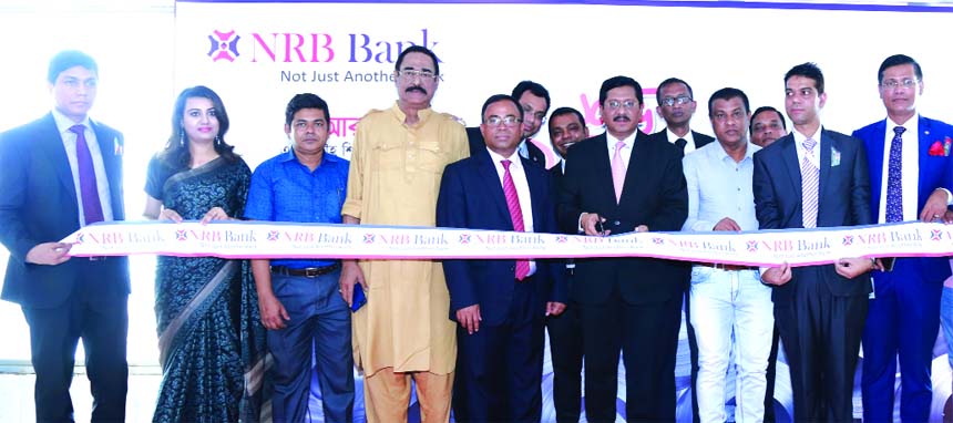 Md. Mehmood Husain, Managing Director of NRB Bank Limited, inaugurating its 37th branch at Kadomtoli of Keranigonj in Dhaka recently. Imran Ahmed, FCA, Chief Operating Officer of the Bank and A K M Kamal Uddin, Head of Corporate Banking were, among others