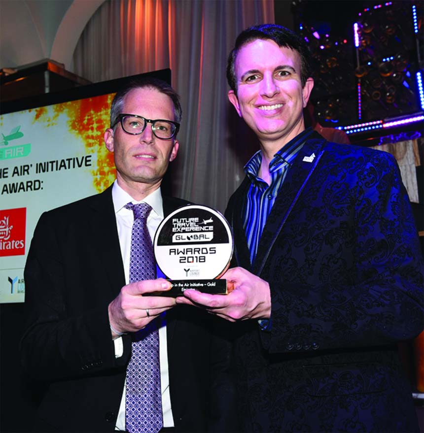 Matthias Schmid Air Emirates' Senior Vice President for North America receives the gold award by Future Travel Experience (FTE) in the "Up in the Air" category from Joe Leader, CEO, Airline Passenger Experience Association (APEX) and CEO, Internatio