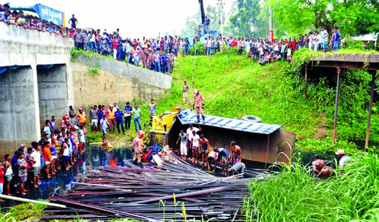 Three including a mother and daughter were killed and some other people injured when a truck plunged into a canal after colliding head-on with another truck over the bridge on Bogura-Dhaka Highway on Wednesday.