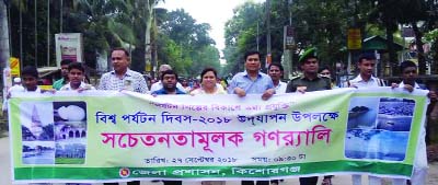 KISHOREGANJ : Kishoreganj District Administration brought out a rally on the occasion of the World Tourism Day yesterday.