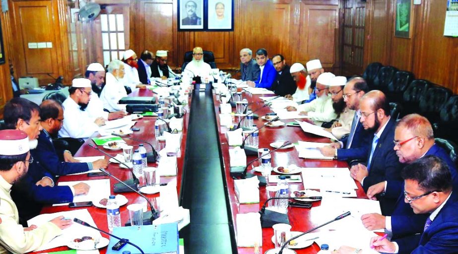 Sheikh Moulana Mohammad Qutubuddin, Chairman of Shariah Supervisory Committee of Islami Bank Bangladesh Limited, presiding over its meeting at the Bank's head office in the city recently. Professor Md. Nazmul Hassan, Chairman of Board of Directors, Md. M