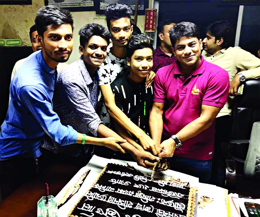 Councilor of 26 No. Ward of Dhaka South City Corporation Hasibur Rahman Manik along with others cutting cake marking 72nd birthday of Prime Minister Sheikh Hasina at the councilor office on Friday.
