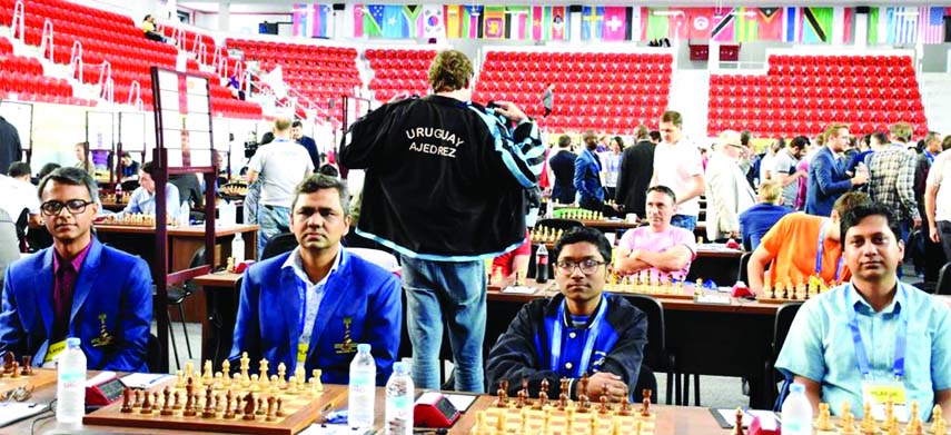 Players of Bangladesh Chess team in action against Algeria Chess team during their matches of the 43rd World Chess Olympiad at Sports Place in Batumi, Georgia on Friday. Bangladesh drew with Algeria 2-2.