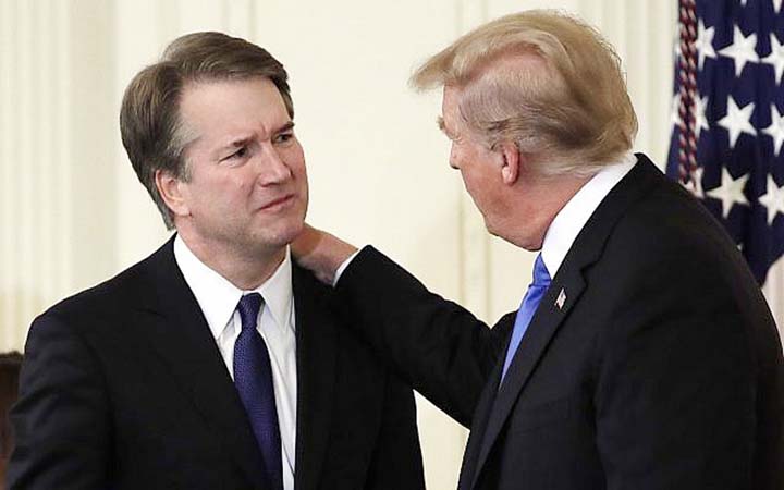 US President Donald Trump (right) greets Judge Brett Kavanaugh, his Supreme Court nominee, in the East Room of the White House in Washington.