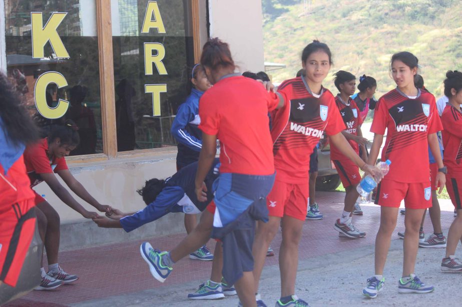 Members of Bangladesh Under-18 National Women's Football team taking part at practice in Bhutan on Saturday.