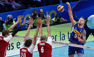 Italy's Ivan Zaytsev (right) spikes the ball during the Men's World Championships volleyball match between Italy and Poland, in Turin, Italy on Friday.