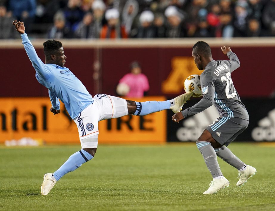 New York City FC midfielder Ebenezer Ofori (12) and Minnesota United midfielder Carlos Darwin Quintero (25) battle for a high ball late in the first half of an MLS soccer match in Minneapolis on Saturday.