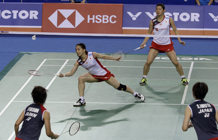 Japan's Misaki Matsumoto (center left) returns a shot near her teammate Ayaka Takahashi during the women's doubles final match against Japan's Yuki Fukushima and Sayaka Hirota at the Korea Open Badminton in Seoul, South Korea on Sunday.