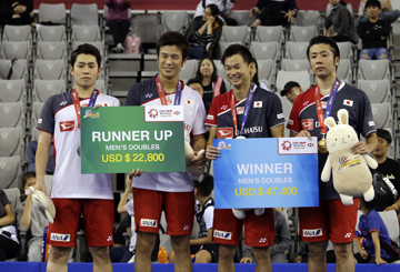 (From right) Japan's Hiroyuki Endo, Yuta Watanabe, Yugo Kobayashi and Takuro Hoki pose during the awards ceremony after competing in the men's doubles final at the Korea Open Badminton in Seoul, South Korea on Sunday. Endo and Watanabe won 2-1.