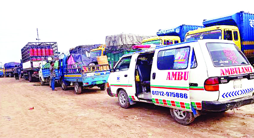 Hundreds of vehicles remained stuck up in long tailback due to navigation problem at Padma River, as ferries movement being disrupted on waterways. This photo was taken from Kathalbari-Shimulia ghat on Sunday.