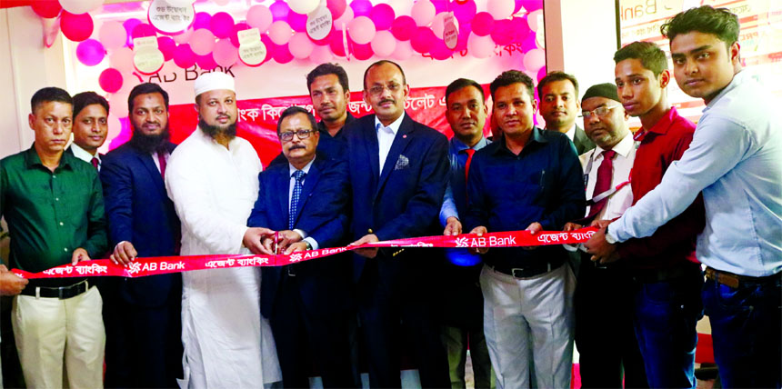Sajjad Hussain, DMD of AB Bank Limited, inaugurating its Agent Banking Outlet at Kuliarchar Bazar in Kishoreganj recently. Syed Mizanur Rahman, Head of Agent Banking Division, senior executives of the Bank and local elites were also present.