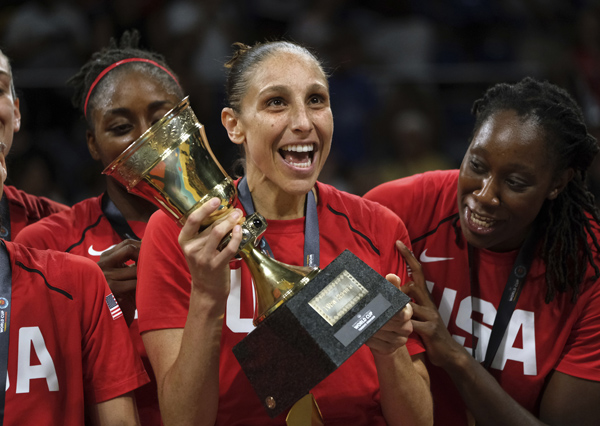 Diana Taurasi of the United States (center) lifts the trophy after winning the Women's basketball World Cup final match between Australia and the USA, in Tenerife, Spain on Sunday.