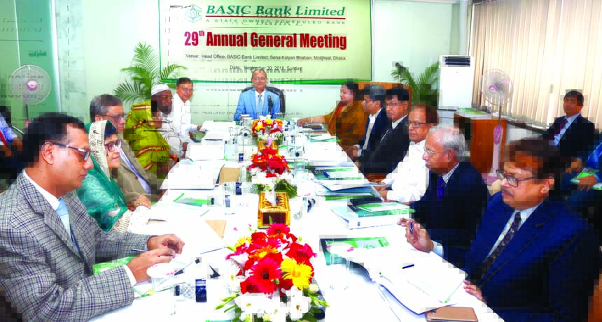 Alauddin A. Majid, Chairman, Board of Directors of BASIC Bank Limited, presiding over its 29th AGM at the Bank's head office in the city on Sunday. Arijit Chowdhury, Additional Secretary of Financial Institutions Division of Finance Ministry, Muhammad Aw