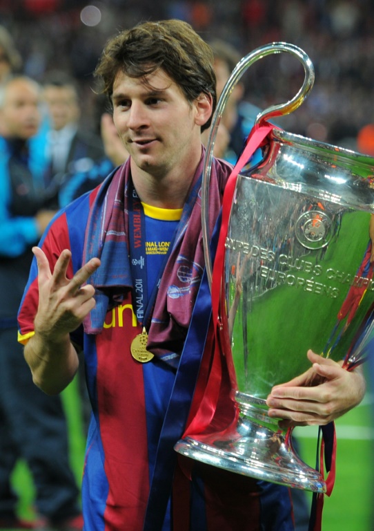 Messi celebrates with the Champions League trophy at Wembley in 2011.