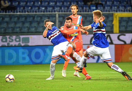 Spal's Andrea Petagna (center) fires a shot during the Serie A soccer match between Sampdoria and Spal at the Luigi Ferraris stadium in Genoa, Italy on Monday.