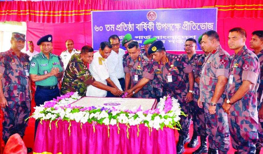 KHULNA: High officials of Boarder Guard Bangladesh (BGB) cutting cake during a dinner party organised on the occasion of the 60th founding anniversary of BGB Khulna Sector on Monday.