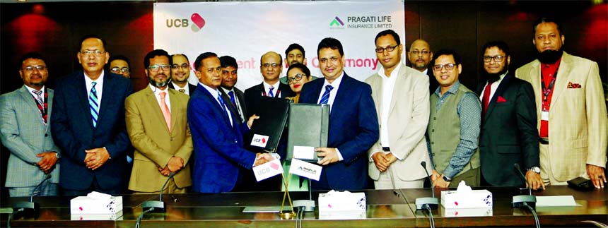 Mohammed Shawkat Jamil, Managing Director (Acting) of United Commercial Bank Limited (UCB) and Jalalul Azim, Managing Director of Pragati Life Insurance Limited, exchanging an agreement signing document to provide the convenience of insurance payments to