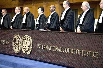 Judges enter the International Court of Justice, or World Court, in The Hague, Netherlands on Wednesday, where they ruled on an Iranian request to order Washington to suspend U.S. sanctions against Tehran.