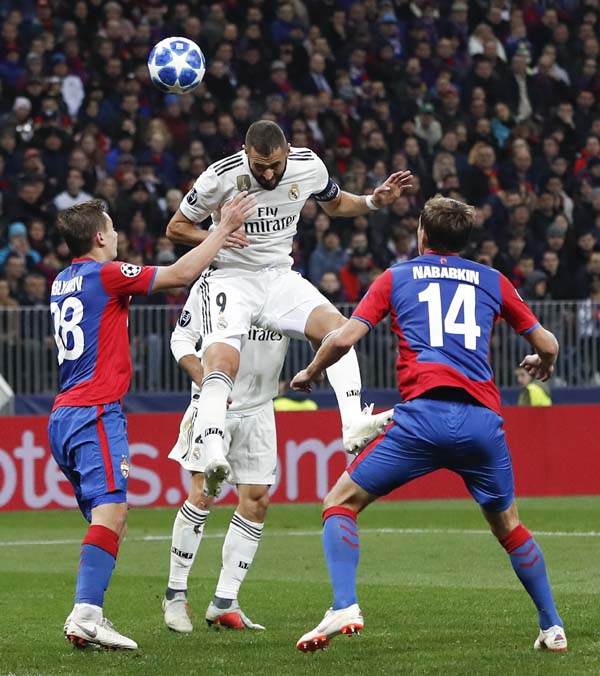 Real forward Karim Benzema (centre) heads the ball during a Group G Champions League soccer match between CSKA Moscow and Real Madrid at the Luzhniki Stadium in Moscow, Russia onTuesday.