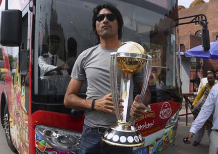 Pakistani cricketer Mohammad Irfan holds the cricket World Cup 2019 trophy outside the Gaddafi Stadium, in Lahore, Pakistan on Wednesday. The trophy is currently on a global tour before it reaches host countries. The cricket World Cup will take place in E