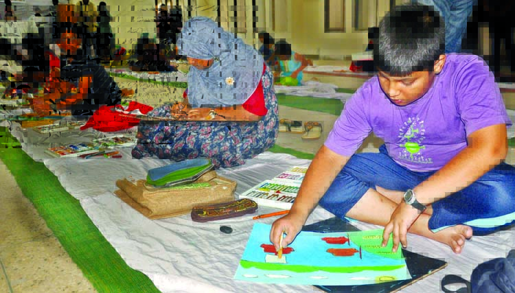 Children engrossed in painting at a drawing competition organised for the wards of members of the Jatiya Press Club in its auditorium on Thursday marking the 64th founding anniversary of the club.
