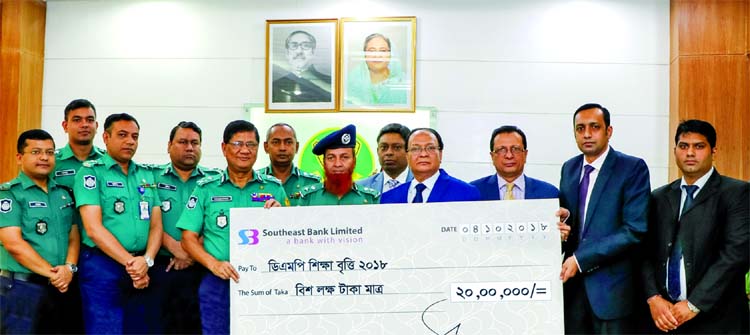 M Kamal Hossain, Managing Director of Southeast Bank Limited, handing over a chaque of Tk 2 million to Dhaka Metropolitan Police (DMP) Commissioner Md. Asaduzzaman Mia, as a part of the Bank's Corporate Social Responsibility (CSR) at DMP Headquarters on