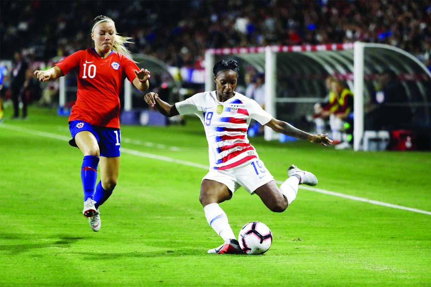 In this Aug. 31, 2018, file photo, United States' Crystal Dunn (right) prepares to strike the ball during the second half of an international friendly soccer match in Carson, Calif. Dunn is pragmatic about her shifting roles: Whatever helps get the US wo