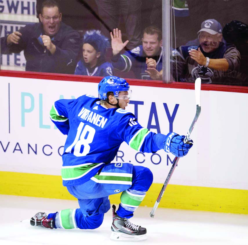 Vancouver Canucks right wing Jake Virtanen celebrates his goal against the Calgary Flames during the third period of an NHL hockey game in Vancouver, British Columbia on Wednesday.