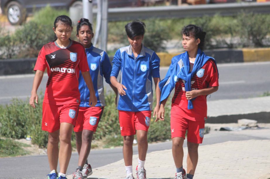 Players of Bangladesh Under-18 National Women's Football team during their morning walk at the street of Thimphu, the capital city of Bhutan on Saturday.