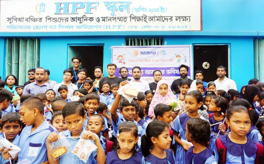 ServicEngineBPO, a leading outsourcing company and sister concern of Abdul Monem Limited distributes milk and water purifier to underprivileged children at HP Foundation School, North Rajarbag, Basabo, Dhaka as a part of its CSR program on Thursday.