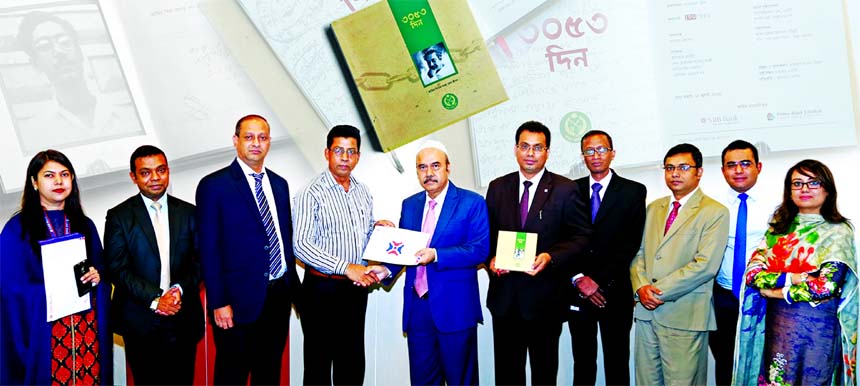 Saaduddin Ahmed, DMD of NRB Bank Limited, handing over a cheque of Tk. 5.00 lakh to Md. Kamal Hossain, Prison Directorates of Bangladesh Jail for sponsorship of the book titled 'Tin Hazar Tipanno Din (3053 Days)' in the prisons of Father of the Nation S
