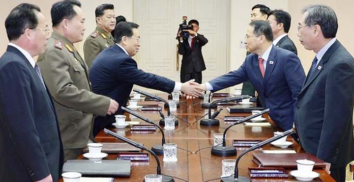 North Korea's nominal head of state Kim Yong Nam, front center, and South Korean Unification Minister Cho Myoung-gyon, front left, attend an event to mark the 11th anniversary of October 4 Declaration at the People's Palace of Culture in Pyongyang, Nort