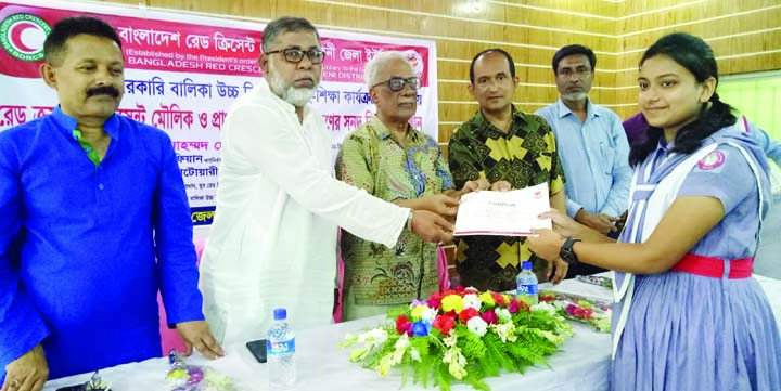 FENI: Aziz Ahmed Chowdhury, Chairman, Feni Zila Parishad and Red Crescent Society distributing certificates among the trainees of first aid at Feni Govt Girls' High School premises organised by Red Crescent Society on Saturday.