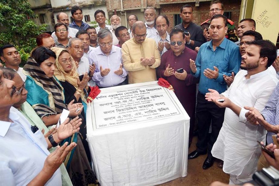 CCC Mayor A J M Nasir Uddin offering Munajat after laying the foundation stone of new academic building of Muslim Education Society High School as Chief Guest on Saturday.