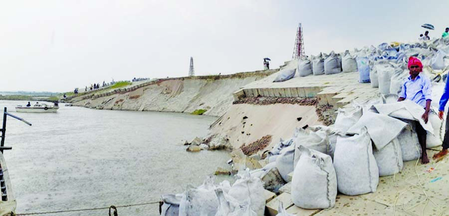 About 120-metre stretch of Sirajganj town protection embankment was collapsed following illegal lifting of sand. This picture was taken on Sunday.