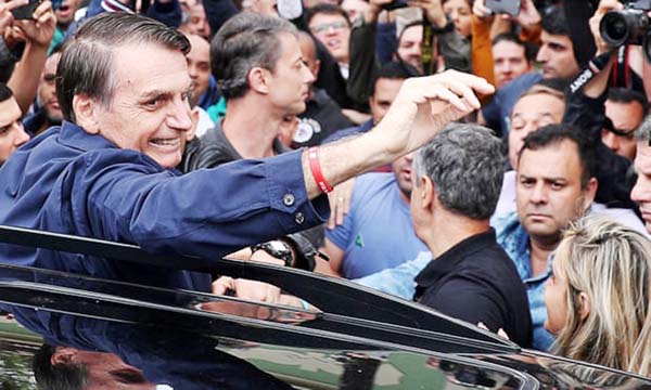 Jair Bolsonaro presidential candidate of the Social Liberal party (PSL) in the Brazilain elections, gestures after casting his vote in Rio de Janeiro.